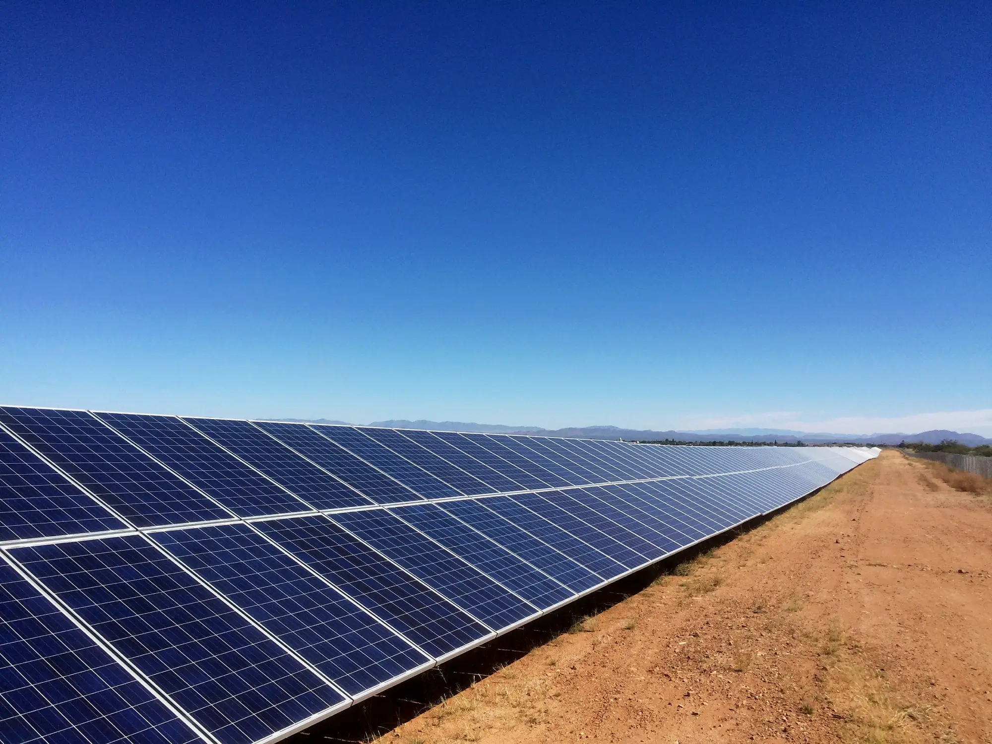Solar panels under clear blue sky